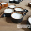 Kaarsenring leer met kaars bruin gevlamd van Hout-Art.
